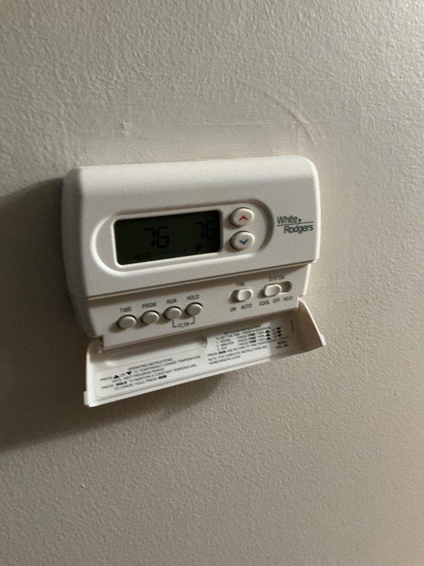 Responded to no-cooling call on 11-year-old residential AC system. Customer reported cold air blowing from outdoor condenser unit accompanied by grinding noise prior to shutdown. Upon arrival, performed diagnostic evaluation of split system with indoor air handler located in basement. Inspected thermostat operation, verified settings, and checked indoor unit components and ductwork connections. Based on customer description of outdoor unit symptoms including abnormal grinding noise and reversed airflow at condenser, identified likely compressor failure or severe mechanical issue with outdoor unit requiring further evaluation of condenser components. Recommended follow-up inspection of outdoor condenser unit to assess compressor condition, fan motor operation, and refrigerant system integrity to determine appropriate repair or replacement options for aging equipment.