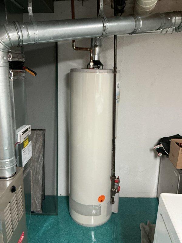 Responded to no-cooling call on 11-year-old residential AC system. Customer reported cold air blowing from outdoor condenser unit accompanied by grinding noise prior to shutdown. Upon arrival, performed diagnostic evaluation of split system with indoor air handler located in basement. Inspected thermostat operation, verified settings, and checked indoor unit components and ductwork connections. Based on customer description of outdoor unit symptoms including abnormal grinding noise and reversed airflow at condenser, identified likely compressor failure or severe mechanical issue with outdoor unit requiring further evaluation of condenser components. Recommended follow-up inspection of outdoor condenser unit to assess compressor condition, fan motor operation, and refrigerant system integrity to determine appropriate repair or replacement options for aging equipment.