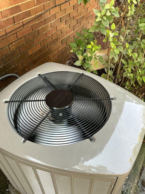Completed Gold AC Inspection on 3-year-old residential air conditioning system. Performed comprehensive inspection of outdoor condenser unit positioned against exterior brick wall, verifying proper operation of fan motor assembly and protective grille. Inspected basement coil location and evaluated overall system performance. Unit found to be in functional condition with normal weathering consistent with outdoor exposure. Confirmed all components operating within manufacturer specifications with no immediate service concerns identified.
