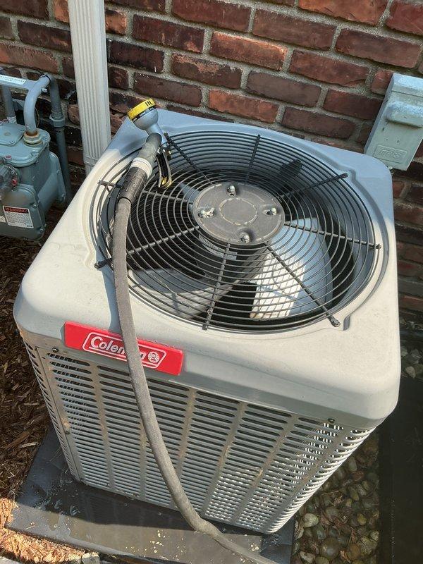 Completed comprehensive Gold AC inspection on 2017 Coleman air conditioning system with condensing unit located exterior and air handler in basement. System confirmed operational with all components functioning properly. Advised customer to maintain clear area around condenser unit, removing any debris and animal waste to ensure optimal airflow and system performance.