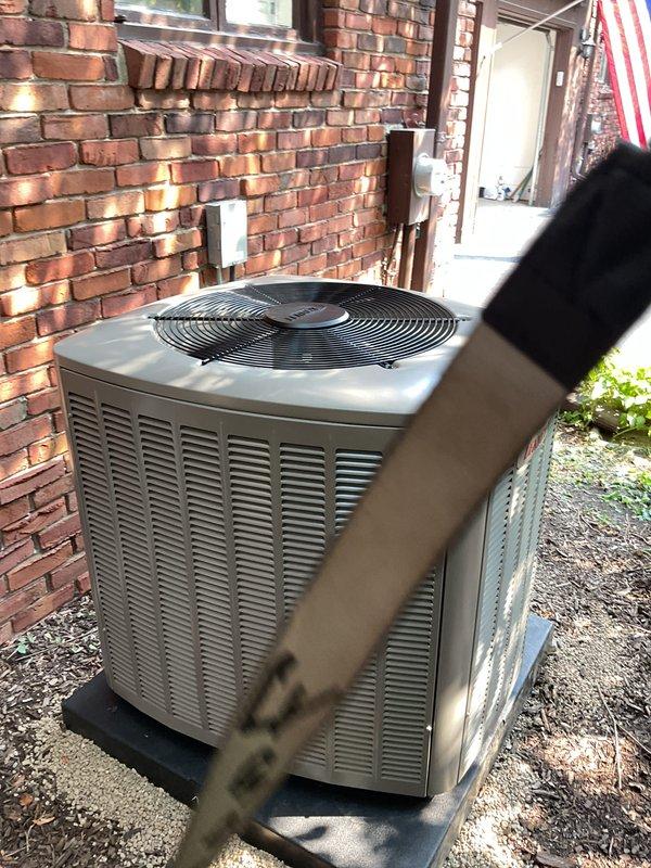 Completed full HVAC system installation including 3-ton air conditioning condenser unit positioned in rear yard on concrete pad with gravel base, and matching evaporator coil installed on furnace in basement utility area. Installed new copper refrigerant lines, PVC condensate drainage with pump, electrical disconnect, and reconnected all mechanical and electrical connections per code requirements. Secured all necessary mechanical, electrical, and HVAC permits prior to installation, installed Sensi thermostat, and registered system for applicable utility rebates with Consumers Energy and DTE.
