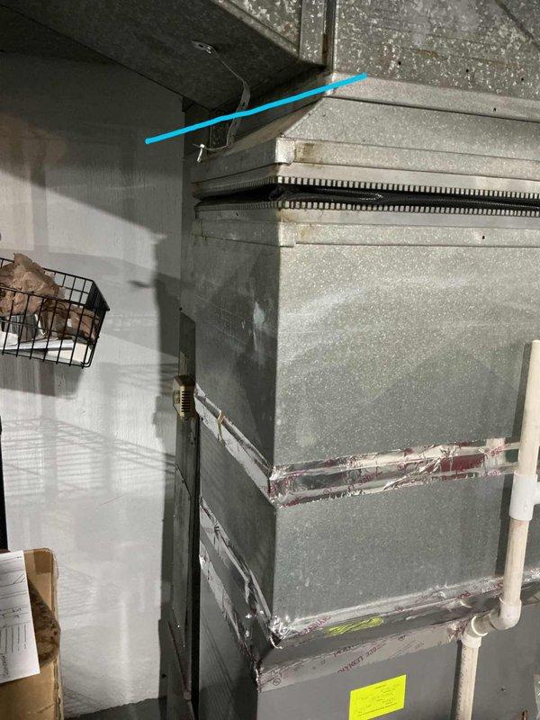 Evaluated existing 10+ year old AC system located in basement that was cooling but not performing properly. System was found to be low on refrigerant charge, indicating potential leak or efficiency issues typical of aging equipment. Provided comprehensive estimate for complete system replacement to address performance concerns and prevent future reliability issues with the deteriorating unit.