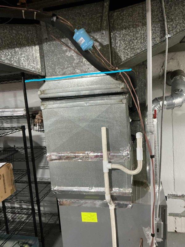 Evaluated existing 10+ year old AC system located in basement that was cooling but not performing properly. System was found to be low on refrigerant charge, indicating potential leak or efficiency issues typical of aging equipment. Provided comprehensive estimate for complete system replacement to address performance concerns and prevent future reliability issues with the deteriorating unit.
