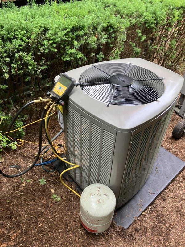 Completed full HVAC system installation including a 70,000 BTU furnace and 3-ton air conditioning unit positioned in right side yard location. Installation included S40 thermostat, condensate pump, and system flush. All mechanical and electrical permits obtained and work performed to code. Unit mounted on concrete pad with proper refrigerant line connections and electrical reconnection to existing service. System charged, tested, and commissioned using manifold gauges to verify proper refrigerant levels and operational parameters. All equipment functioning within manufacturer specifications upon completion. AHRI certificate number 215660766 documentation provided for utility rebate qualification.