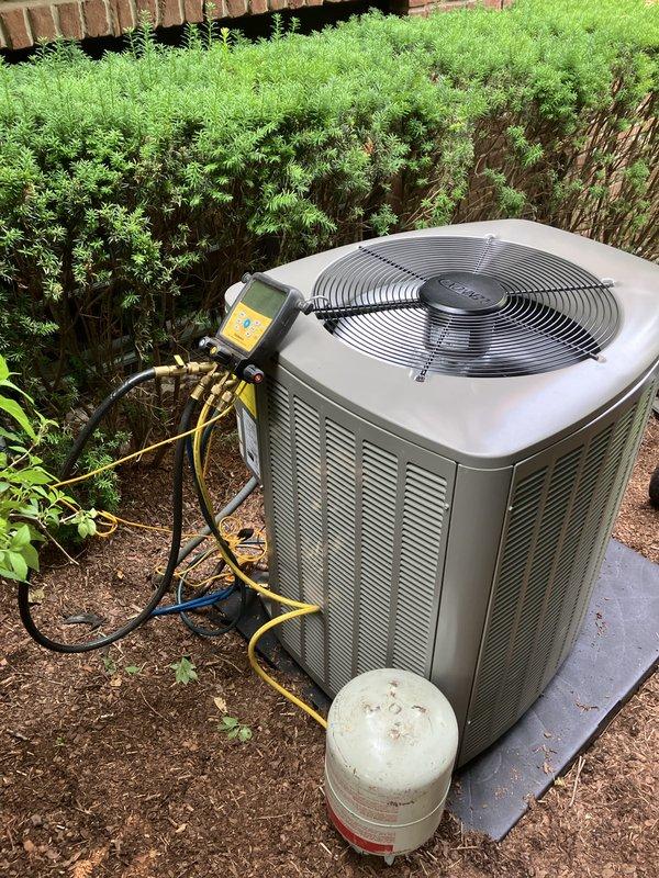 Completed full HVAC system installation including a 70,000 BTU furnace and 3-ton air conditioning unit positioned in right side yard location. Installation included S40 thermostat, condensate pump, and system flush. All mechanical and electrical permits obtained and work performed to code. Unit mounted on concrete pad with proper refrigerant line connections and electrical reconnection to existing service. System charged, tested, and commissioned using manifold gauges to verify proper refrigerant levels and operational parameters. All equipment functioning within manufacturer specifications upon completion. AHRI certificate number 215660766 documentation provided for utility rebate qualification.