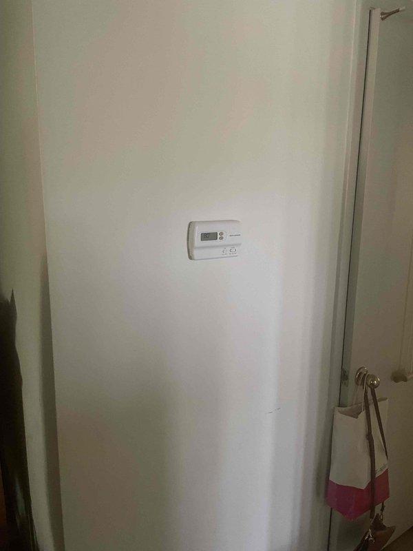 Responded to service call for air conditioning system not cooling. Upon arrival, evaluated 10-year-old outdoor AC unit that was running but failing to produce cool air. Conducted comprehensive system assessment and provided detailed estimate for complete system replacement due to age and current operational failure. Documented existing thermostat and indoor equipment configuration with photos for replacement planning purposes.