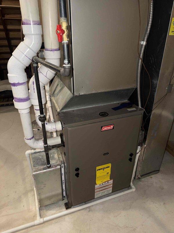 Responded to no-cool call on 12-year-old Coleman AC system with non-operational outdoor fan. Upon inspection, diagnosed failed condenser fan motor and capacitor on outdoor unit. Replaced defective fan motor with OEM-equivalent component, installed new dual-run capacitor, and verified proper amperage draw. System tested successfully with normal cooling operation restored and airflow confirmed at both indoor air handler and outdoor condensing unit.