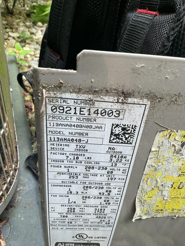 Completed comprehensive Gold AC Inspection on a 5-year-old Goodman model 113ANA048-J air conditioning system utilizing R410A refrigerant. Unit located on exterior concrete pad with adequate clearance and vegetation management. Performed full system evaluation including electrical connections, refrigerant pressures, condenser coil inspection, fan motor operation, and capacitor testing. All components operating within manufacturer specifications with no deficiencies noted. System demonstrated proper cooling capacity and airflow. Exterior cabinet showed normal weathering with minor surface growth, which does not affect performance. Documented unit specifications and captured photographic records of equipment condition for maintenance history.