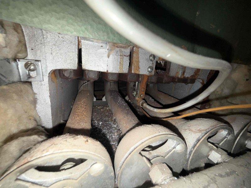 Responded to no cooling call on 10+ year old AC unit located in attic. Upon arrival, confirmed system was not powering on. Accessed unit through attic hatch and inspected equipment. Found extensive rust and corrosion on electrical components and mounting hardware, indicating prolonged moisture exposure in attic environment. Documented deteriorated condition of wiring, connections, and metal surfaces. Photographed corroded components and compromised mounting board for customer records. Advised homeowner of findings and provided recommendations for system replacement due to age and advanced deterioration of critical components.