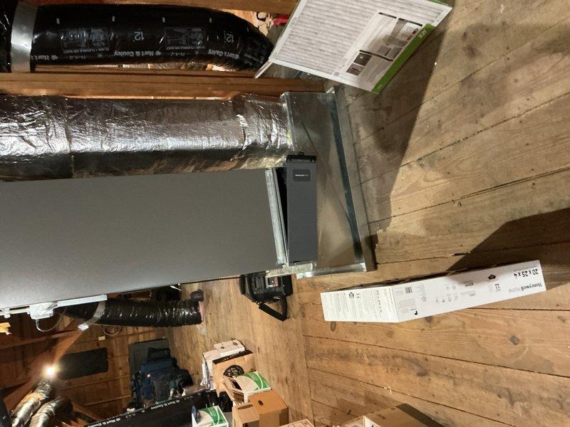 Completed comprehensive Gold AC inspection on 3-year-old residential air conditioning system with air handler located in basement. Performed visual inspection of indoor air handler unit, ductwork, and outdoor condensing unit, confirming all components are operational and properly installed. Verified adequate airflow through supply and return vents, inspected flexible ductwork for proper support and insulation integrity, checked condensate drainage system functionality, and examined outdoor unit for proper clearance from landscaping and debris. System operating within normal parameters with no immediate service needs identified.