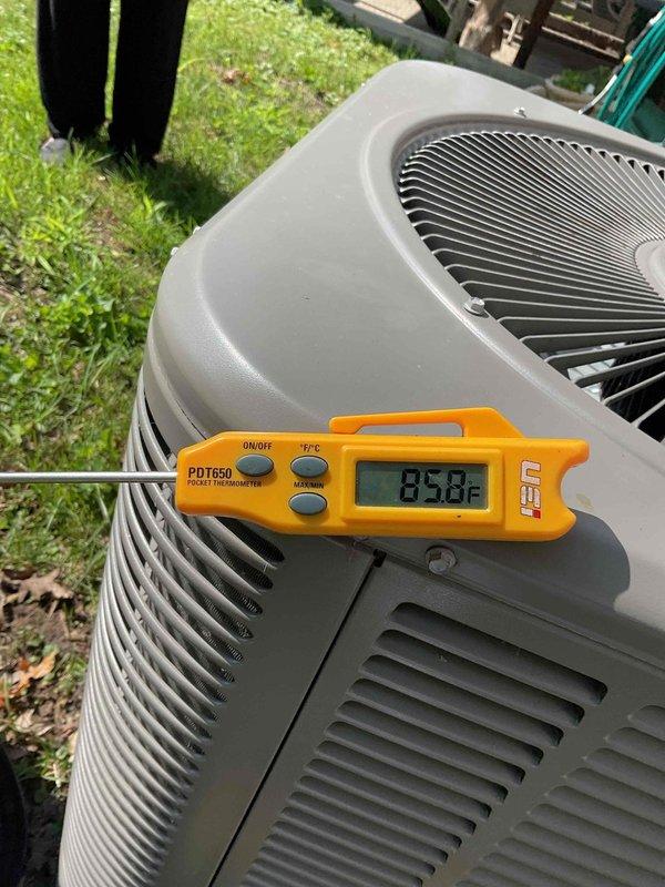 Responded to no-cool complaint on 10+ year old residential air conditioning system serving main floor hallway area. Upon arrival, performed diagnostic assessment of outdoor condenser unit and measured operational temperatures using calibrated digital thermometer, recording ambient temperature reading of 89.8°F at the unit. Conducted comprehensive system evaluation including visual inspection of condenser housing, protective grilles, and metal fin condition. Unit showed normal exterior wear consistent with age but fins appeared clean and unobstructed. Completed requested routine maintenance inspection in conjunction with no-cool diagnostic. Documented system conditions with photographs for service records. System assessed and maintenance procedures performed to address cooling deficiency on aging equipment.