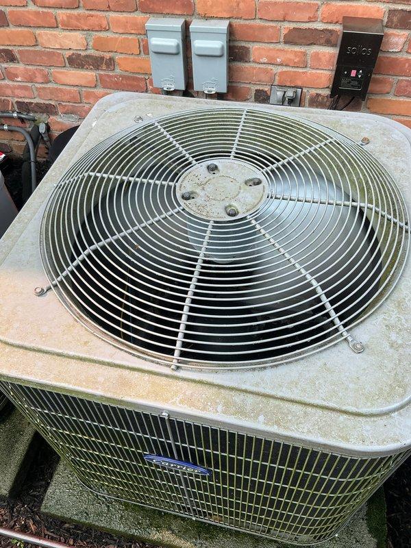 Completed Gold AC Inspection and cooling maintenance on residential HVAC system experiencing inconsistent temperature distribution across basement, first, and second floors. Performed comprehensive tune-up on outdoor condenser unit, which showed signs of age with weathering, dirt accumulation, and surface discoloration on cabinet and fan grille assembly. Inspected mini split system in garage and evaluated overall system performance to address cooling deficiencies reported on warm days.