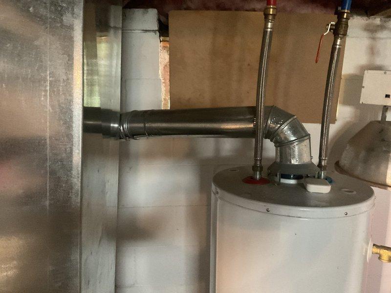 Provided comprehensive plumbing estimate to address code violations identified during property inspection. Assessment included evaluation of water heater installation, supply line connections, drainage piping, and associated plumbing fixtures in basement utility area. Inspection revealed non-compliant installations requiring correction to meet current plumbing codes, including improper pipe support, inadequate venting configurations, and outdated valve assemblies showing significant corrosion and oxidation. Documented existing conditions of flexible braided supply lines with color-coded hot and cold water connections, metallic drainage elbows, and PEX tubing distribution system. Quote encompasses necessary modifications to bring all plumbing components into compliance with municipal building codes and ensure proper functionality of water heater connections and drainage systems.