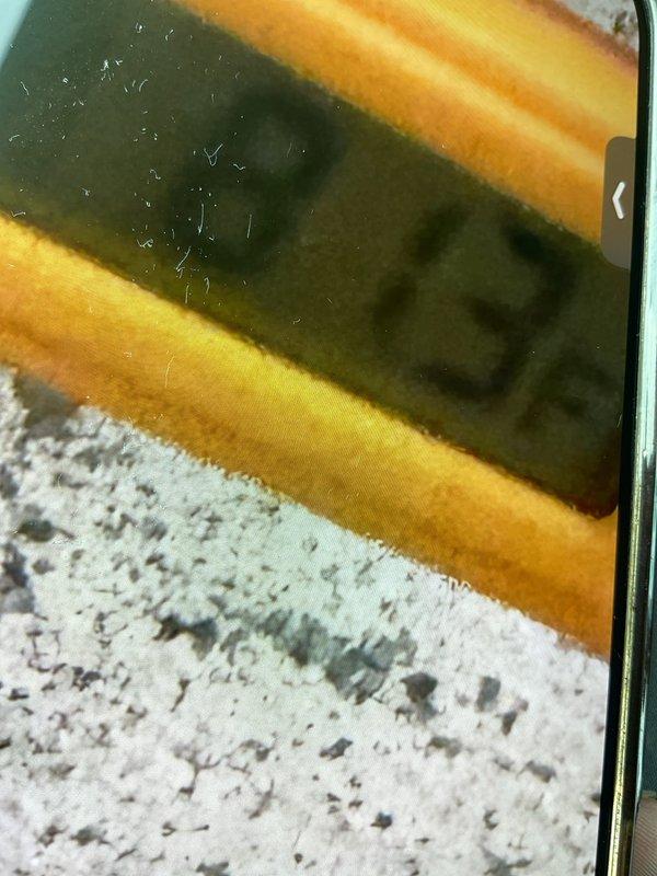 Responded to service call for non-operational AC fan on cooling equipment located in basement. Upon inspection, diagnosed issue with condenser fan motor failure preventing proper airflow through the system. Documented equipment model number 1756 and overall unit condition with photos for service records.