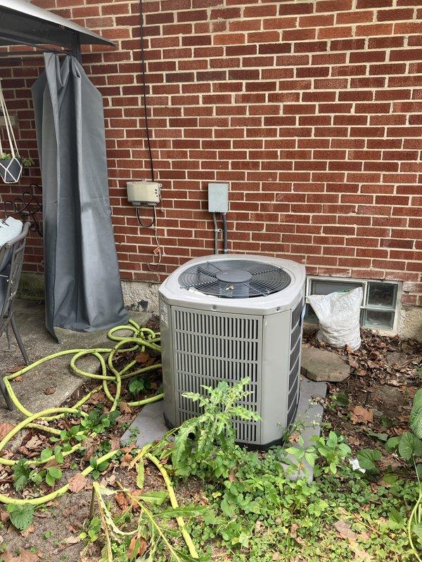 Responded to service call for non-operational air conditioning system affecting entire residence. Upon arrival, located 14-year-old AC unit in basement area and outdoor condenser unit positioned on concrete pad against building exterior. Conducted comprehensive system evaluation and diagnostics to determine root cause of complete system failure.

Inspection revealed critical safety issue: cracked heat exchanger identified during thorough examination of heating components. This condition poses potential carbon monoxide hazard and renders system unsafe for continued operation. Heat exchanger failure at this age is consistent with normal wear and equipment lifecycle expectations.

Evaluated outdoor condenser unit positioned on exterior concrete pad. Noted vegetation growth around base of unit and general outdoor equipment condition. Assessed electrical connections, refrigerant lines, and condensate drainage routing along building foundation. Documented existing installation configuration 