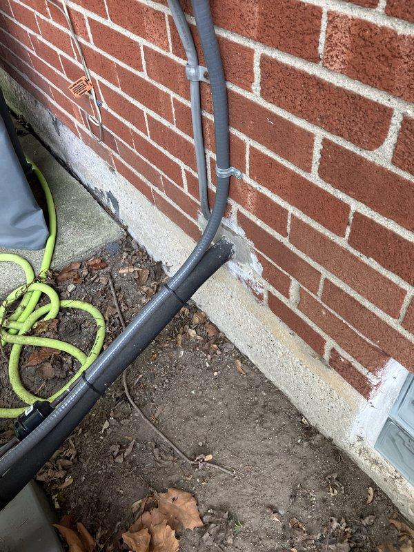 Responded to service call for non-operational air conditioning system affecting entire residence. Upon arrival, located 14-year-old AC unit in basement area and outdoor condenser unit positioned on concrete pad against building exterior. Conducted comprehensive system evaluation and diagnostics to determine root cause of complete system failure.

Inspection revealed critical safety issue: cracked heat exchanger identified during thorough examination of heating components. This condition poses potential carbon monoxide hazard and renders system unsafe for continued operation. Heat exchanger failure at this age is consistent with normal wear and equipment lifecycle expectations.

Evaluated outdoor condenser unit positioned on exterior concrete pad. Noted vegetation growth around base of unit and general outdoor equipment condition. Assessed electrical connections, refrigerant lines, and condensate drainage routing along building foundation. Documented existing installation configuration 