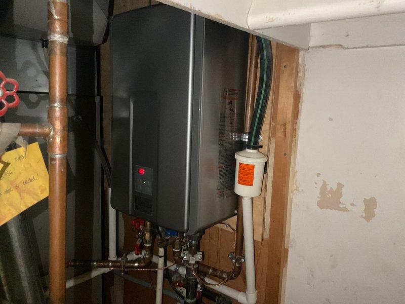 Performed routine maintenance flush on tankless water heater system to remove mineral buildup and sediment accumulation. Isolated unit using existing service valves, connected flushing equipment with descaling solution, and circulated cleaning agent through heat exchanger for optimal performance. Inspected all copper supply lines, valve assemblies, and connections for proper operation; verified system restored to normal function with no leaks detected upon completion.