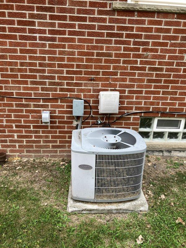 Completed estimate for replacement of residential HVAC system including 24-year-old air conditioning unit and existing furnace. Evaluated current Carrier condensing unit located on exterior concrete pad behind residence, connected to Sensi digital thermostat. Provided equipment replacement recommendations and installation specifications for complete system upgrade.