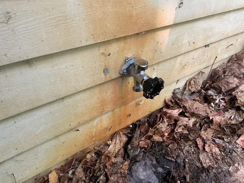 Replaced frost-free outdoor hose spigot mounted on exterior siding. Installed new fixture with proper copper pipe connections and brass valve assembly in basement utility area, ensuring secure mounting and leak-free operation for seasonal water access.