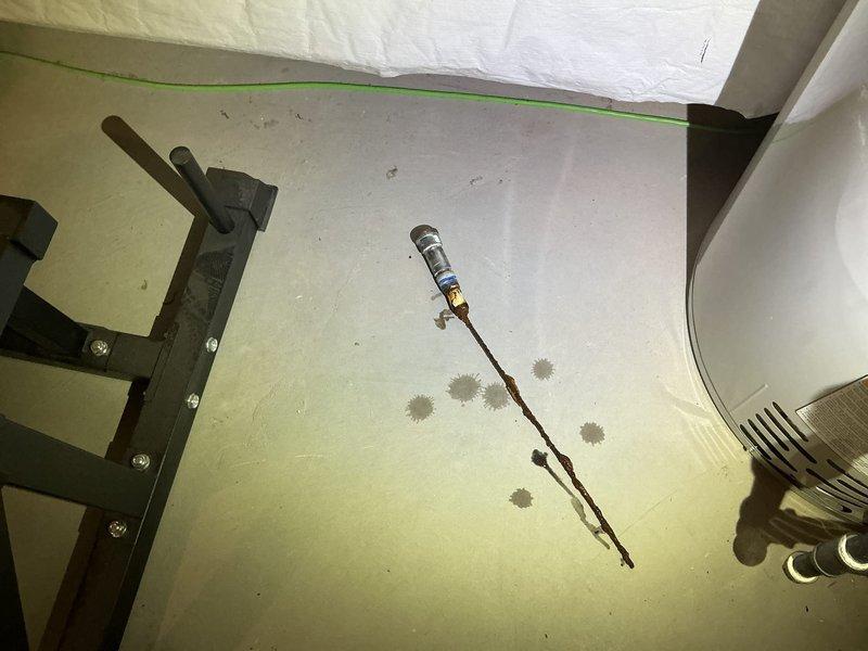Replaced deteriorated anode rod in water heater to prevent tank corrosion and extend equipment lifespan. The existing rod showed significant corrosion and mineral buildup, indicating it had reached the end of its effective service life. Installed new anode rod and verified proper fitting to ensure continued protection of the water heater tank.