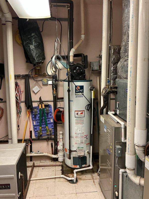 Responded to service call for 50-gallon Rheem PowerVent water heater experiencing intermittent flame failure, with unit shutting down approximately every three days. Performed diagnostic inspection of the power vent system, including examination of the blower motor assembly, gas valve operation, and ignition components. Assessed venting system integrity, verified proper combustion air supply, and inspected flame sensor and thermocouple functionality to identify root cause of pilot light extinguishing issue.