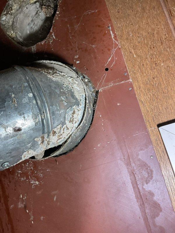 Responded to service call for Whirlpool tanked water heater experiencing extended heating times. Upon inspection, found unit to be over 10 years old with sediment buildup affecting heating efficiency. Assessed gas burner assembly, thermostat controls, and temperature-pressure relief valve functionality. Inspected flue vent penetration and verified proper venting with adequate sealing at wall penetration point. Evaluated overall condition of unit including plumbing connections, gas line integrity, and safety controls. Documented equipment age and performance issues, noting unit approaching end of serviceable life expectancy. Provided homeowner with findings and recommendations for addressing slow heating performance.