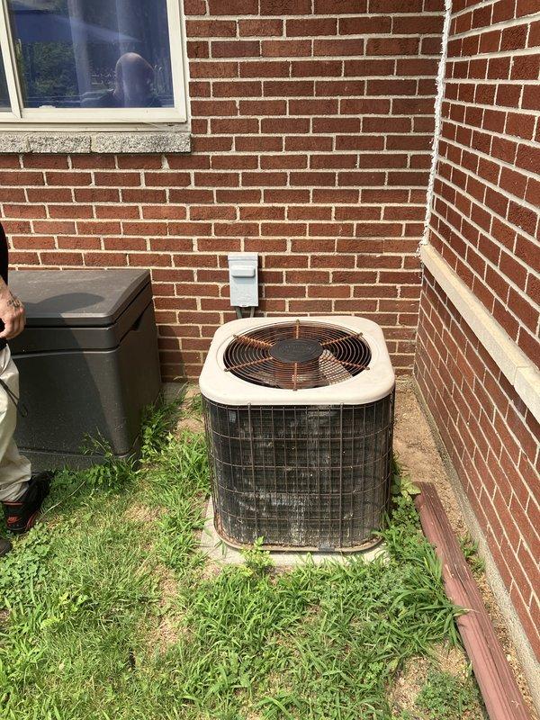 Conducted comprehensive site evaluation for complete HVAC system replacement at residential property. Assessed existing outdoor condensing unit positioned on concrete pad against brick exterior wall, along with associated electrical disconnect box and control components. Documented current equipment configuration, electrical infrastructure including junction box and conduit routing, and available installation space for new system components. Provided detailed sales estimate for full system replacement including new condensing unit, air handler, and all necessary electrical connections and controls to meet customer's requirements for brand new HVAC equipment installation.