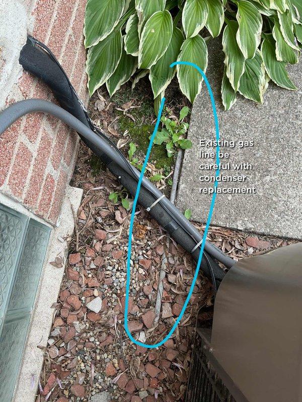Conducted on-site evaluation and provided replacement estimate for 21-year-old air conditioning system located at rear of residence and furnace unit positioned on east wall of basement. Documented existing equipment configuration, photographed outdoor condensing unit on concrete patio adjacent to brick wall, and identified existing gas line routing near condenser location requiring careful consideration during replacement installation.