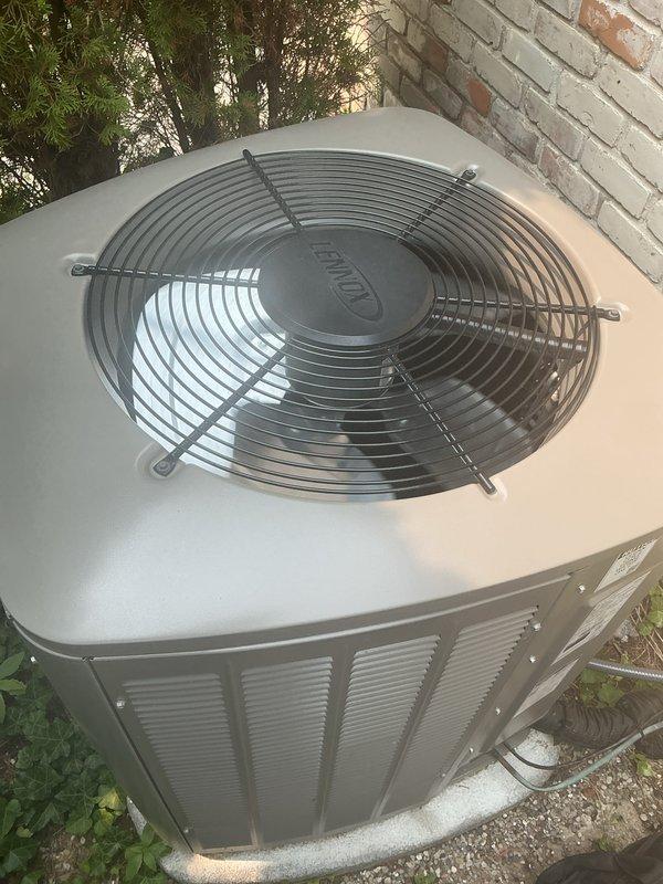 Completed comprehensive Gold AC inspection on Lennox condensing unit positioned on exterior concrete pad with air handler located in basement. System is under 10 years old and operating properly at time of inspection. Verified proper operation of condenser fan motor, checked refrigerant pressures, inspected electrical connections, and evaluated overall system performance. Advised customer to maintain clear area around outdoor unit, removing any debris and animal waste to ensure adequate airflow and prevent potential system issues.