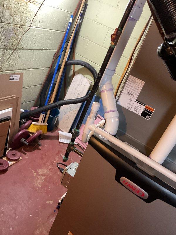 Completed installation of 90,000 BTU high-efficiency furnace in mechanical room with all necessary connections and components. Installed new PVC condensate drain piping with proper pitch and trap configuration, reconnected existing electrical service, and integrated unit with existing ductwork using flexible transition connections. Programmed and mounted new digital thermostat, verified all safety controls and operational sequences, and confirmed proper airflow and combustion efficiency upon startup.