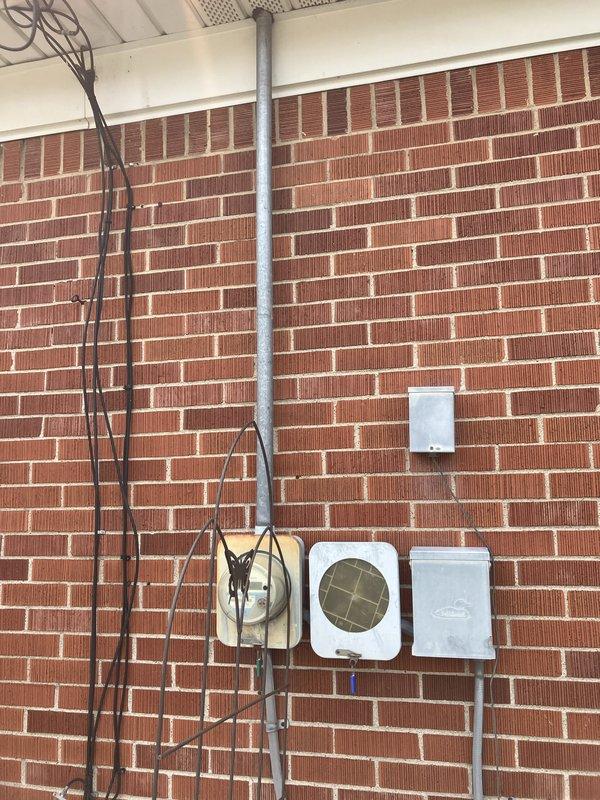 Provided comprehensive estimate for Kohler residential standby generator installation at exterior brick wall location. Evaluated existing electrical infrastructure including conduit routing, utility box placement, and determined optimal pad placement on lawn area adjacent to building. Assessed natural gas fuel source availability and confirmed adequate clearances from windows, HVAC equipment, and property lines for code-compliant generator positioning.