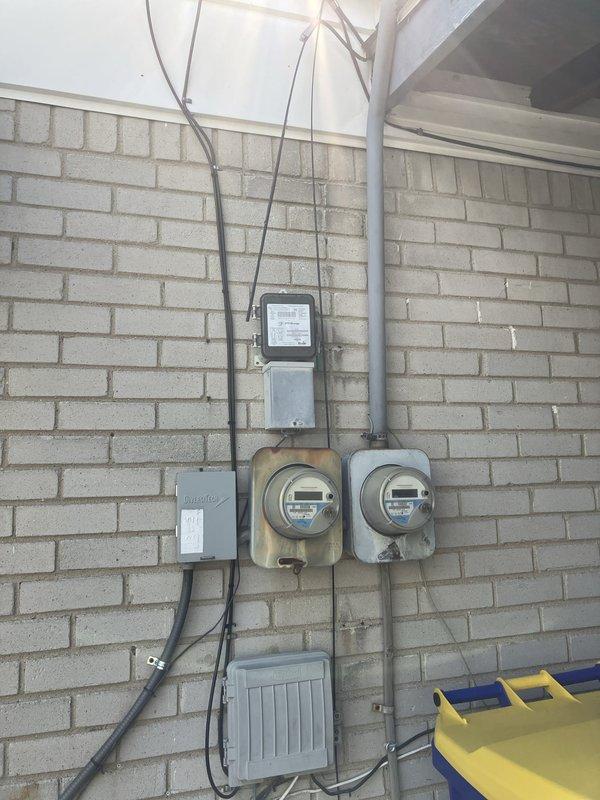 Completed full AC system replacement for unit over 10 years old. Removed existing outdoor condensing unit and indoor air handler from basement location. Installed new outdoor condensing unit against exterior brick wall with proper refrigerant line insulation and electrical disconnect. Routed new refrigerant lines through flexible conduit secured to building exterior with appropriate mounting brackets. Connected system to existing electrical service and verified proper voltage at outdoor unit. Tested system operation, confirmed proper refrigerant charge levels, and verified all safety controls functioning correctly.