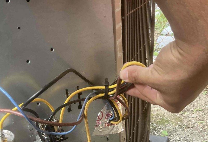 Responded to no-cooling call on 2020 AC unit with non-operational outdoor condenser. Upon inspection, identified failed dual-run capacitor (Totaline P291-405M, 40+5 MFD 370V) preventing compressor and condenser fan operation. Replaced defective capacitor, verified proper electrical connections at contactor and capacitor terminals, and tested system operation. Unit restored to normal cooling function with compressor and outdoor fan running properly.
