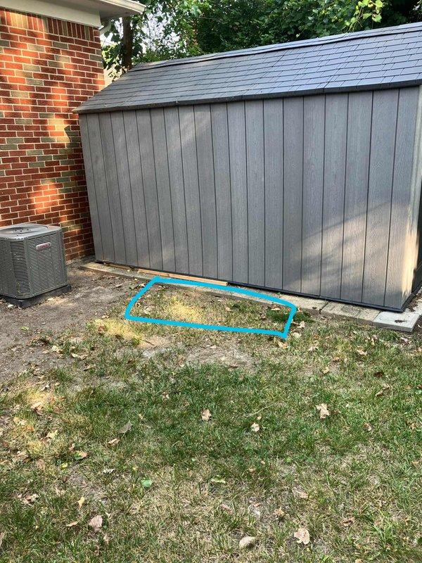 Completed electrical estimate for new whole home generator installation at residential property. Assessed existing natural gas meter and service line capacity on exterior brick wall, evaluated optimal generator placement location in backyard adjacent to existing HVAC equipment and wooden shed, and documented current electrical panel configuration. Identified suitable concrete pad installation area with adequate clearance from structure and utilities, confirmed natural gas availability for generator fuel source, and verified compliance requirements for permanent standby generator system integration with existing electrical service.