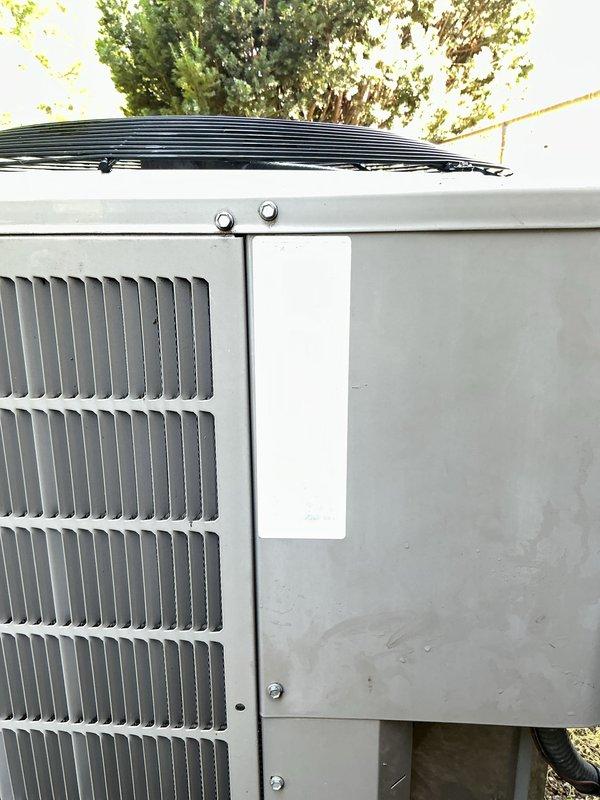 Completed comprehensive Gold Plan air conditioning maintenance on a 10-year-old basement-located AC unit. Performed full system inspection including examination of outdoor condenser unit, verified proper operation of all components, and inspected refrigerant line connections which showed age-appropriate patina and weathering on brass valves and copper piping. Checked condenser coils, fan operation, and electrical connections; cleaned exterior surfaces and verified secure mounting of all panels and hardware. Unit operating within normal parameters with no immediate service concerns identified; documented equipment condition with photographs for maintenance records.