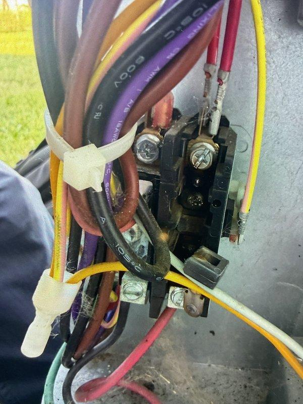 Responded to no cooling call on 5-year-old system located in attic above garage. Found blower motor operating but compressor and condenser unit not running. Safety float switch in drain pan had tripped to red position due to condensate backup; reset switch to green position and verified proper drainage. Inspected electrical connections at air handler, checked wiring terminations and control board for proper voltage and continuity. System remained non-operational after float switch reset, indicating potential issue with compressor contactor, capacitor, or low voltage control circuit requiring further diagnostic testing and component replacement.