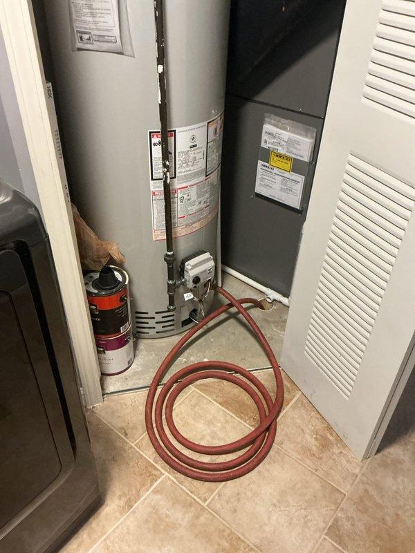 Performed routine maintenance flush on a Bradford White 50-gallon natural gas water heater, model RG250T6N. Drained sediment buildup from tank bottom through drain valve to improve heating efficiency and extend unit lifespan. Verified proper operation of temperature and pressure relief valve, inspected all visible connections for leaks, and confirmed manufacturer labels and safety warnings remain legible and intact.