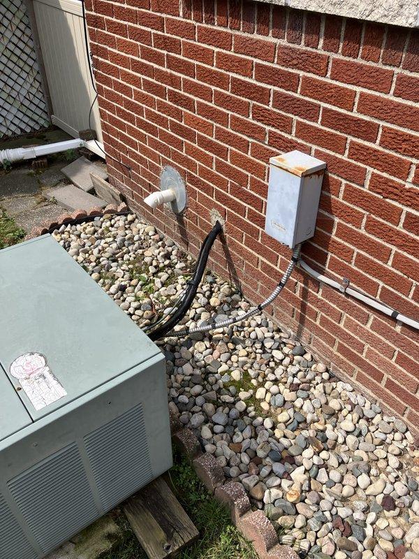 Conducted comprehensive assessment of existing 10+ year old HVAC system including natural gas furnace located in basement and air conditioning condenser unit positioned on exterior concrete pad with white gravel landscaping. Evaluated current equipment operational status, documented existing installation configuration including electrical connections, conduit routing, and utility box placement on brick exterior wall. Provided detailed replacement estimate for complete furnace and air conditioning system upgrade to improve efficiency and reliability of residential heating and cooling equipment.