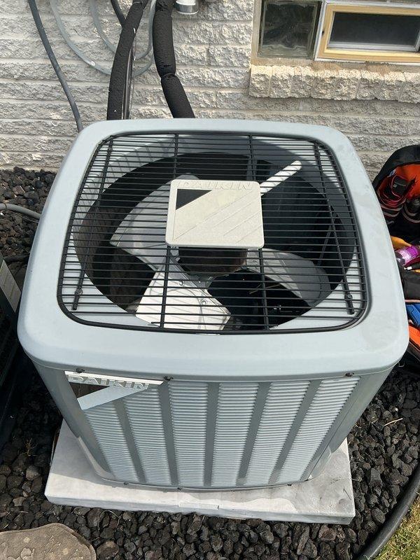 Completed comprehensive Gold AC Inspection and tune-up on two Goodman air conditioning condenser units located on exterior of building. Both systems were operational at time of service. Performed full preventive maintenance protocol including visual inspection of condensing units, verified proper refrigerant line insulation, checked electrical connections and conduit routing, inspected mounting pads and surrounding gravel base for levelness and stability, examined fan blade operation and protective grilles, and documented equipment condition through photographic records. Both units showed normal wear consistent with routine operation, with no immediate repairs required at this time.