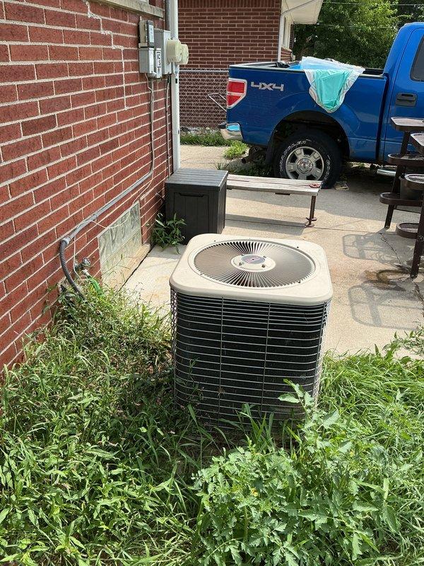 Conducted on-site evaluation of existing Lennox air conditioning condenser unit at residential property to provide replacement estimate. Assessed current equipment condition, location constraints, electrical service access, and refrigerant line routing for new system installation planning. Documented equipment specifications, installation site conditions including concrete pad placement against brick exterior wall, and clearance requirements for replacement unit sizing recommendations.