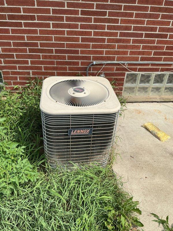 Conducted on-site evaluation of existing Lennox air conditioning condenser unit at residential property to provide replacement estimate. Assessed current equipment condition, location constraints, electrical service access, and refrigerant line routing for new system installation planning. Documented equipment specifications, installation site conditions including concrete pad placement against brick exterior wall, and clearance requirements for replacement unit sizing recommendations.