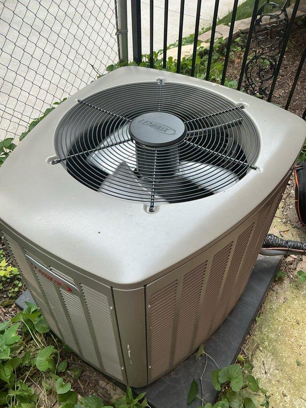 Responded to callback for multi-zone system not operating properly since previous visit. Diagnosed upstairs thermostat failure to engage air conditioning unit while main floor thermostat functioned correctly. Tested thermostat wiring by jumping terminals at upstairs location with no response from system, indicating wire failure between upstairs thermostat and zone control board. Main floor zone confirmed operational with proper cooling. Installed hard start kit on compressor to resolve startup issues, resulting in proper compressor operation and system function for main floor zone. Scheduled follow-up appointment for electrician to run new thermostat wire from upstairs location to zone board to restore full system functionality to upper level.