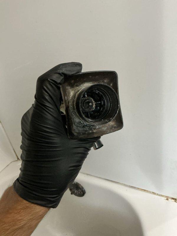 Responded to bathroom shower faucet malfunction where the handle was continuously spinning without controlling water flow or shutting off the water supply. Diagnosed failed shower cartridge in the Pfister shower valve assembly. Replaced defective cartridge, restoring proper operation of the temperature control handle and water shut-off functionality.