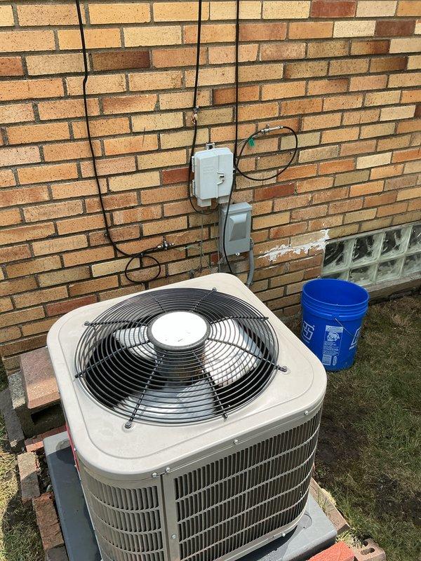 Completed Gold AC Inspection on 7-year-old residential air conditioning and furnace system located in basement. Performed comprehensive inspection of outdoor condenser unit, verified proper operation of compressor and condenser fan motor, checked refrigerant levels and electrical connections at disconnect boxes, and inspected condenser coil fins for debris or damage. All components found operating within normal parameters with no immediate service needs identified.