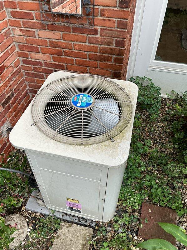 Completed comprehensive Gold AC Inspection on outdoor residential condensing unit. Performed full system diagnostics including electrical component inspection, verified dual-run capacitor terminals (20mfd and 50mfd ratings) with proper color-coded wiring connections intact, checked all electrical connections at control panel, and inspected exterior cabinet condition. Unit showed normal wear consistent with age, operating within manufacturer specifications with no immediate service needs identified.