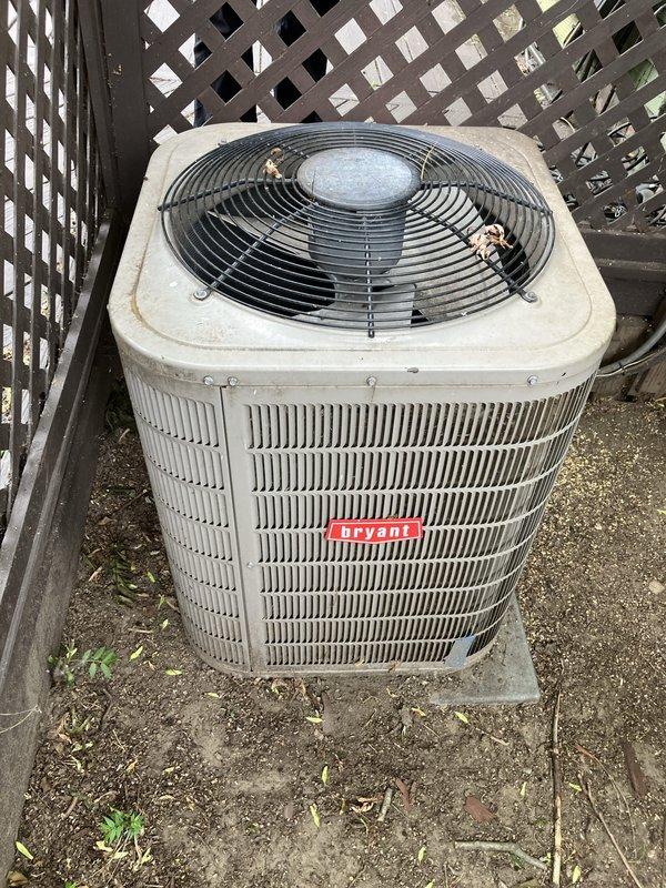 Responded to emergency no-cooling call for elderly homeowner during high temperature conditions. Evaluated 10+ year old Bryant air conditioning system located at residence with condenser unit positioned on exterior concrete pad adjacent to perimeter fencing. Unit exhibited significant age-related deterioration including weathered cabinet surfaces, dirt accumulation, and overall wear consistent with decade-plus outdoor exposure. Conducted comprehensive system assessment and provided full HVAC system replacement estimate including both furnace and air conditioning equipment to address failed cooling system and aging infrastructure.