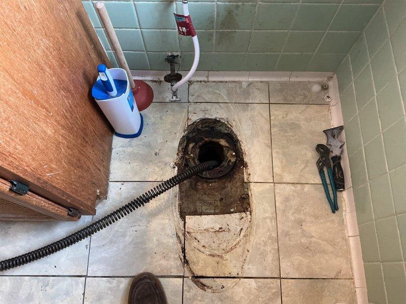 Responded to service call for toilet gurgling during shower operation, indicating a drainage system issue. Upon inspection, identified a blockage in the main drain line affecting proper venting and water flow. Deployed professional drain snake equipment through the floor drain to clear the obstruction in the waste line. Successfully removed blockage, restoring proper drainage function and eliminating the gurgling symptom. Verified system operation and confirmed resolution of venting issue.