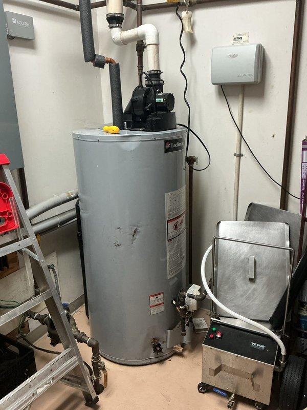 Responded to service call for commercial water heater displaying error codes in rear utility room. Upon arrival, inspected A.O. Smith industrial tanked water heater unit and assessed mechanical systems. Diagnosed error condition, performed necessary troubleshooting procedures using socket set and hand tools to access and evaluate internal components. Resolved error code issue and verified proper operation of water heater system. Unit returned to normal functioning status with all mechanical systems operating within manufacturer specifications.