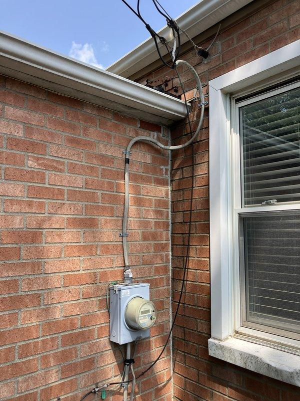 Conducted on-site assessment for adding air conditioning system to existing 3-year-old furnace installation in basement. Evaluated current HVAC infrastructure, electrical service capacity at meter location, and thermostat compatibility for future AC integration. Documented existing Emerson thermostat and exterior electrical service configuration to determine equipment requirements and installation specifications for complete cooling system addition.