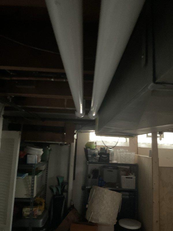 Completed full HVAC system installation including 70,000 BTU furnace and 2.5 ton air conditioning unit positioned in right side yard. Installed new thermostat, humidifier, and ductwork system with proper insulation throughout basement area. Added electrical disconnect and reconnected all power supply connections to panel, ensuring proper circuit protection and code compliance for both mechanical and electrical components.
